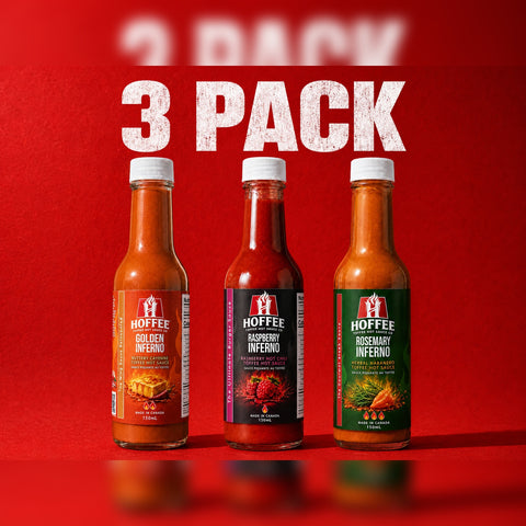 Three bottles of HOFFEE hot sauce on a red background