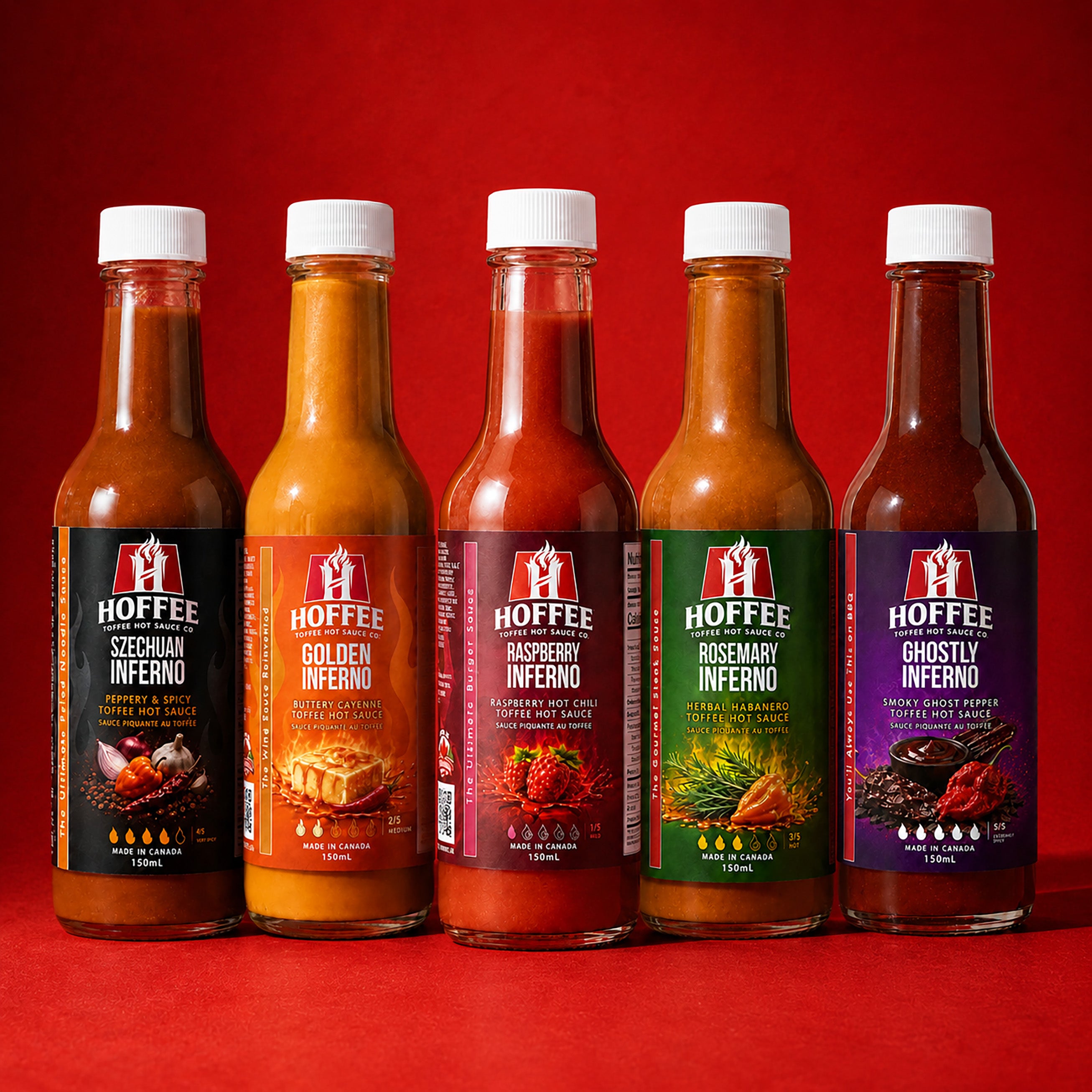 Five bottles of HOFFEE hot sauce with colorful labels on a fiery background.
