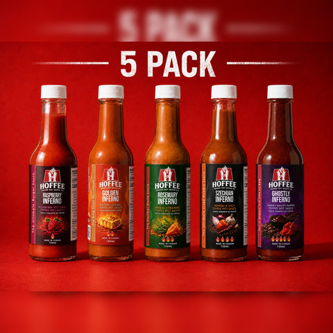 Five bottles of HOFFEE hot sauce with colorful labels on a fiery background.